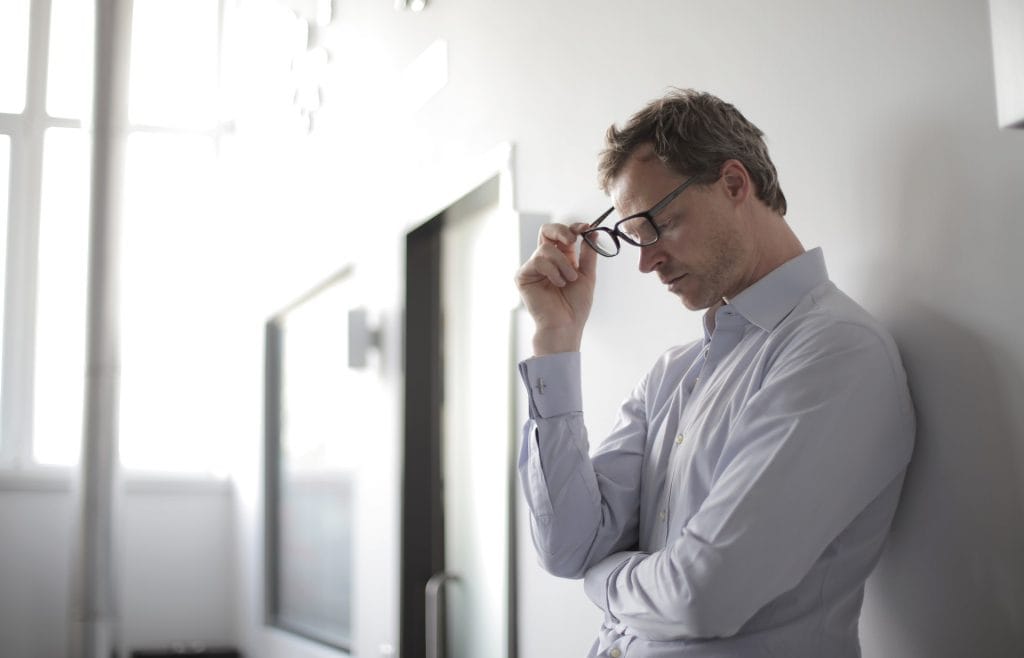 Man leaning on wall