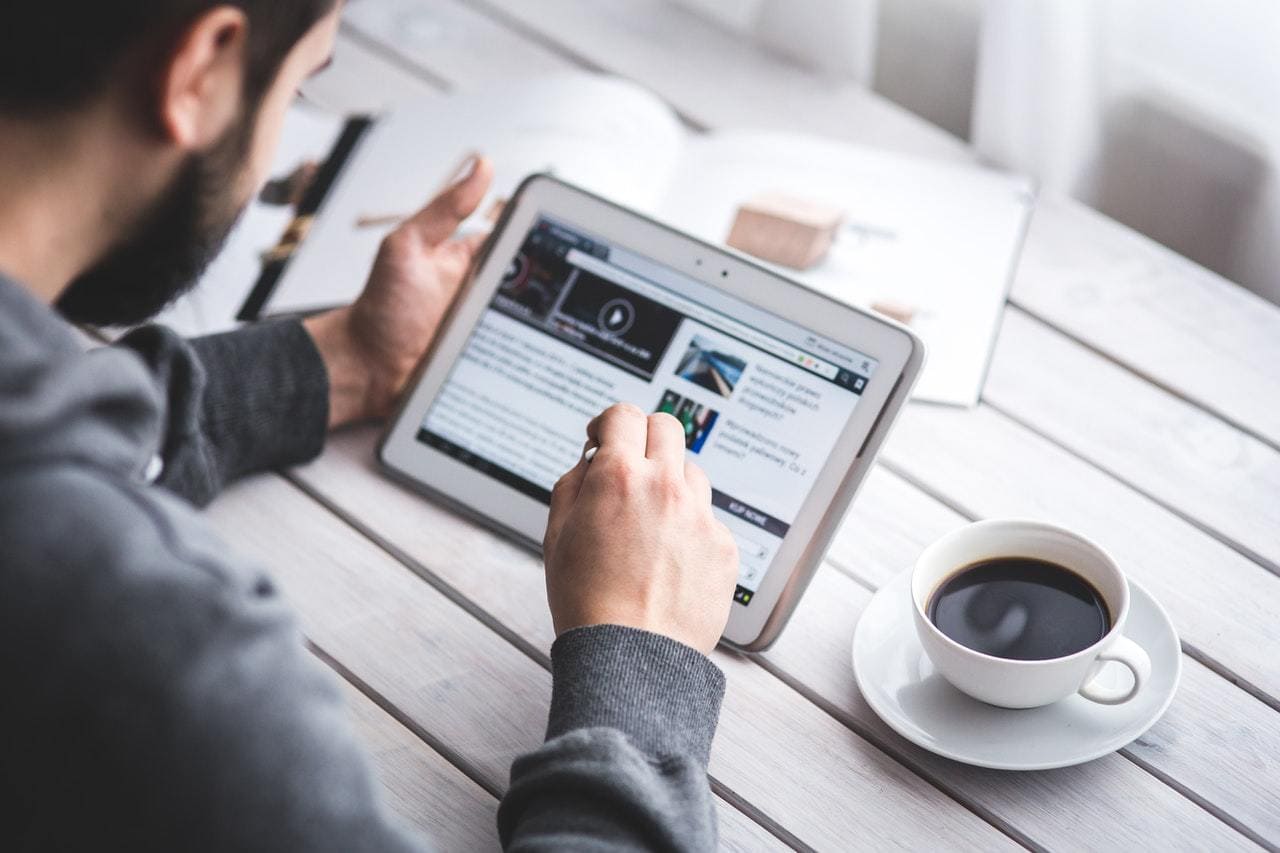 Man looking at blog post