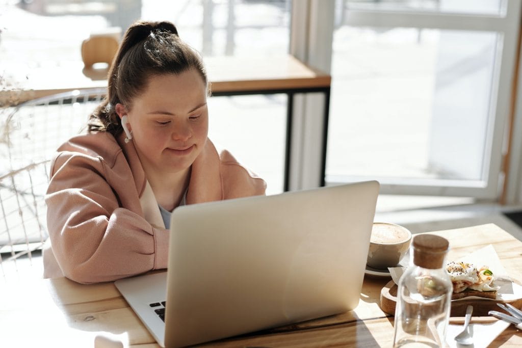 Woman with Down syndrome using pc