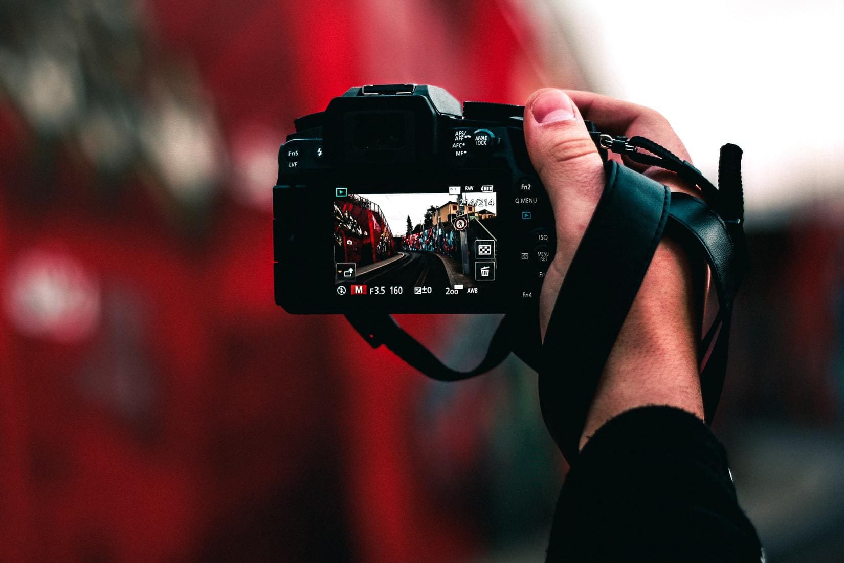 Person holding DSLR