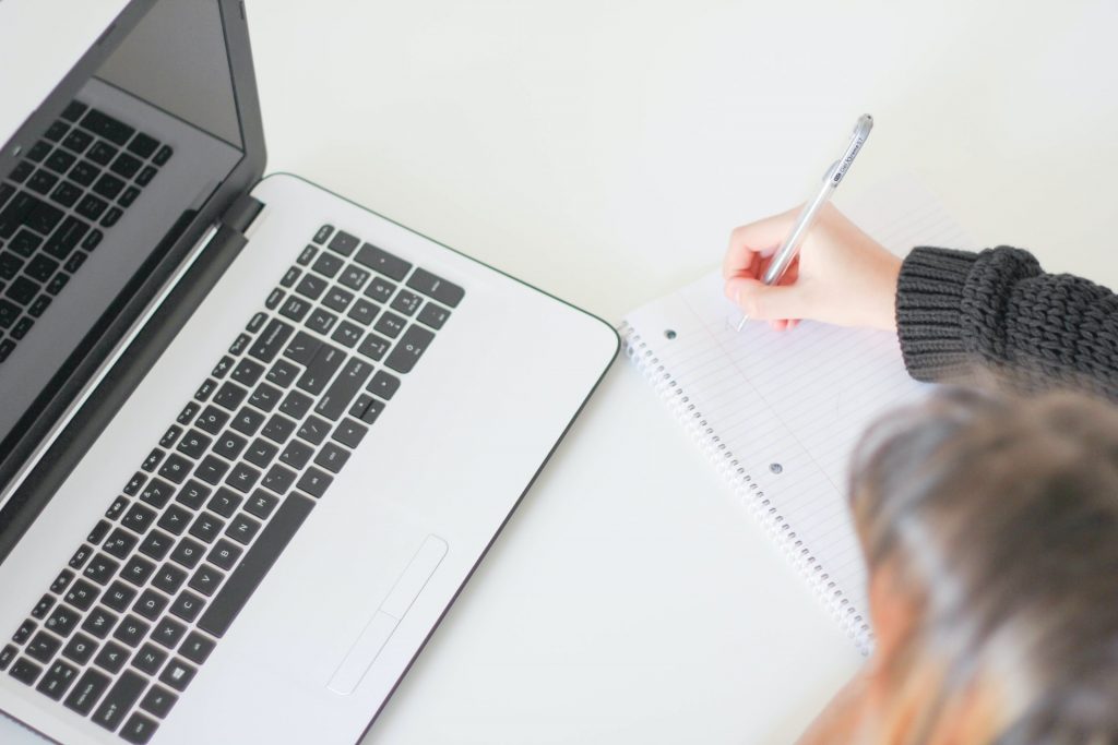 Woman writing something down