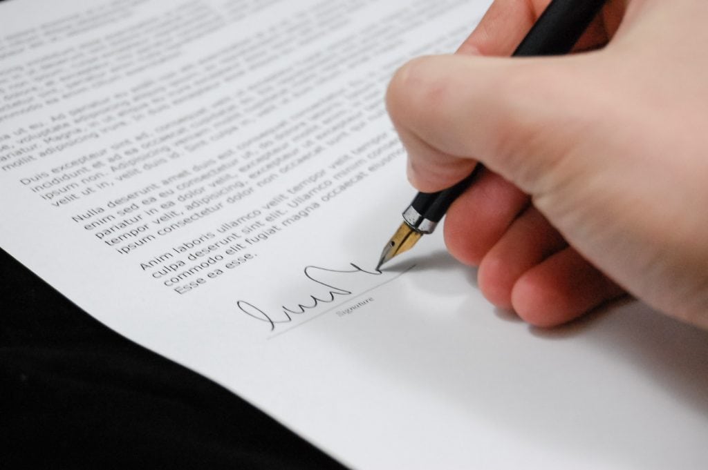 Person signing contract 