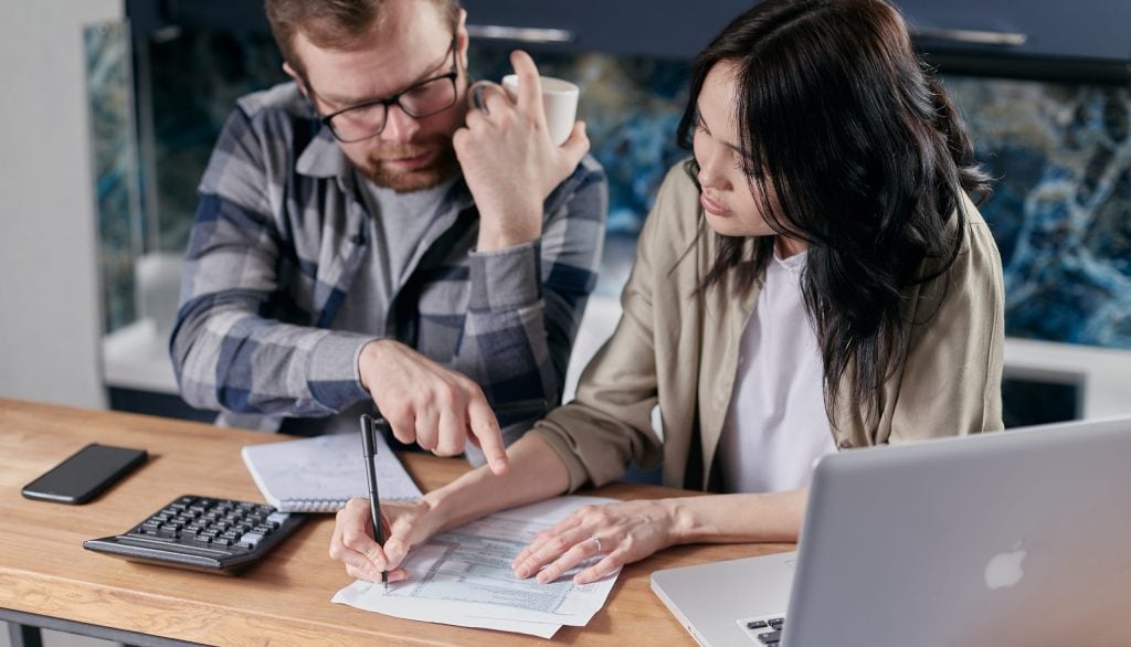 Couple calculating all their bills