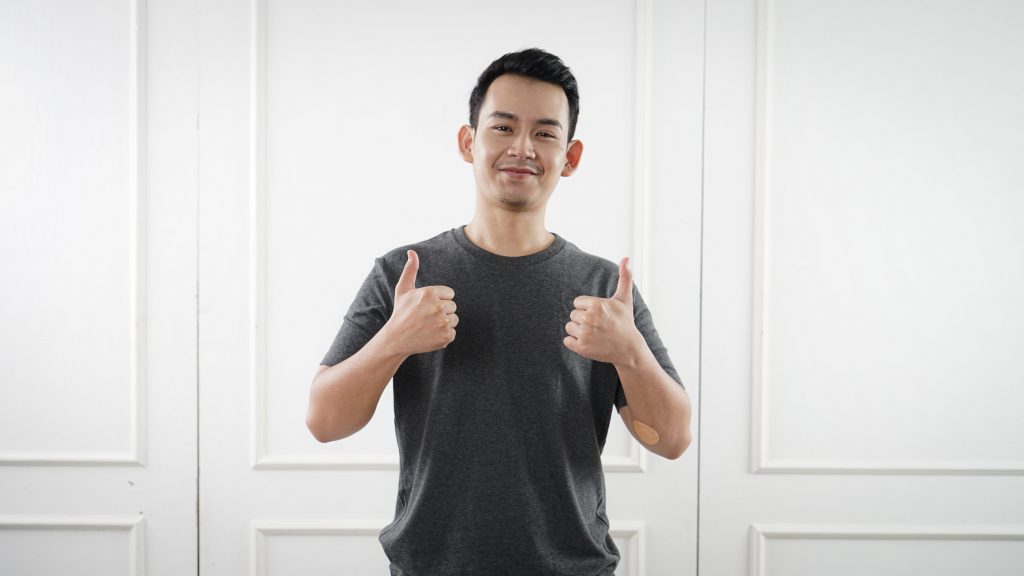 Man giving thumbs up to camera