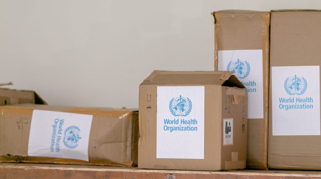 Cardboard boxes with world health organization sticker