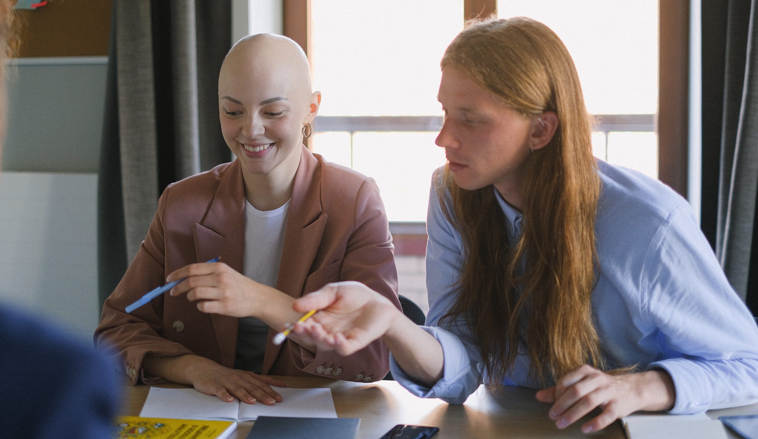 Cheerful colleagues working in office