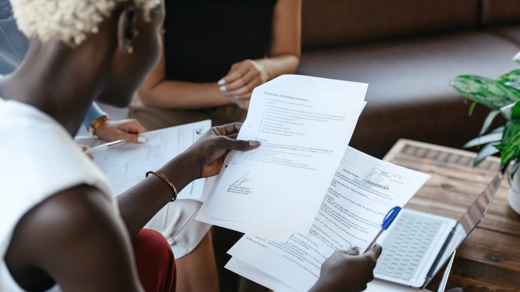 Black woman reading information of important document