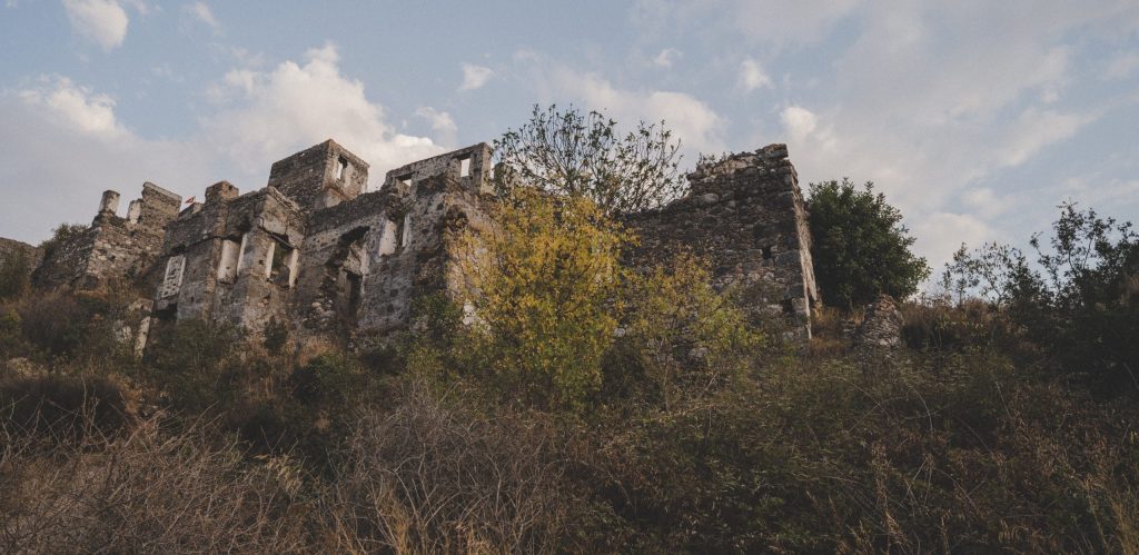 Ghost Town Kayaköy / Livissi. With origins in the 14th century, Kayaköy was forcefully abandoned at the end of the Greco-Turkish War when a population exchange meant that Muslims and Christians were exchanged between Greece and Turkey so that each country could claim one major religion in the path toward ethnic and national homogeneity. Today Kayaköy village serves as a museum and is a historical monument. Around 500 houses remain as ruins and are under the protection of the Turkish government. Sources: Wikipedia, theculturetrip.com