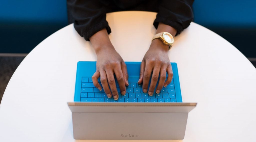 Person typing on a laptop