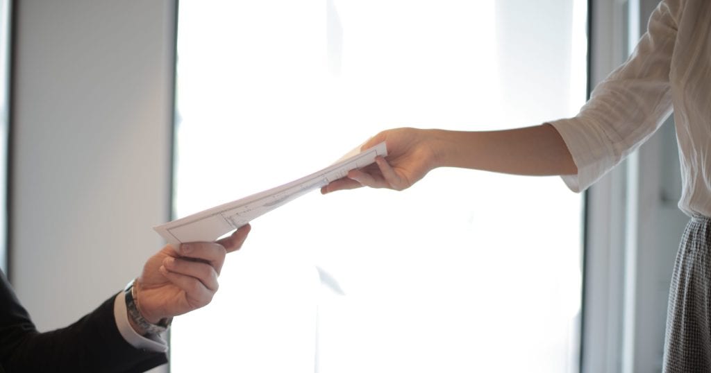 Job applicant passing her documents